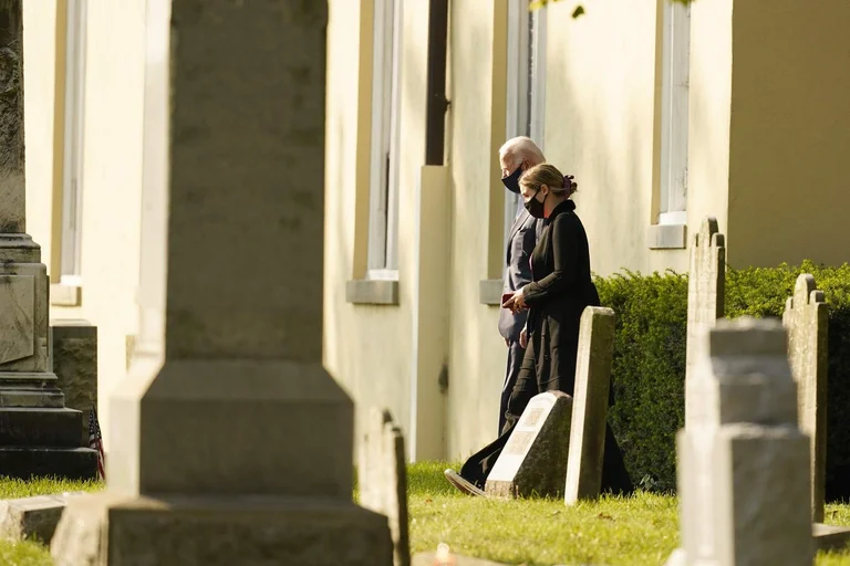 Before voting, Joe Biden stops at the church where many family members are buried.
