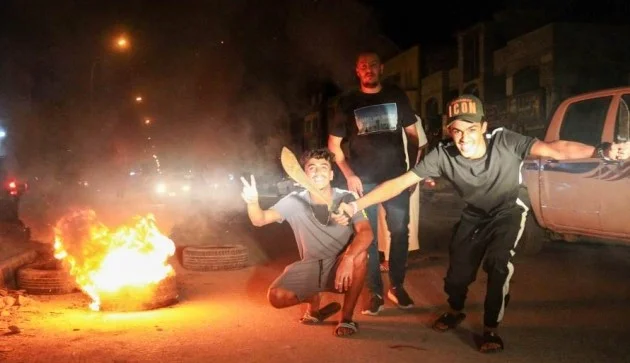 Protesters set the parallel government building on fire in Libya