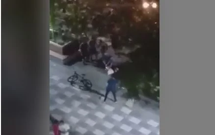 Movie view, how does the citizen try to escape in the middle of the Lipjan square?