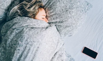 Is sleeping on the phone harmful: What Experts Say