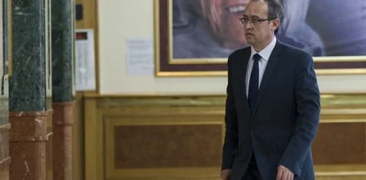 Hoti speaks to reporters today after returning from Brussels