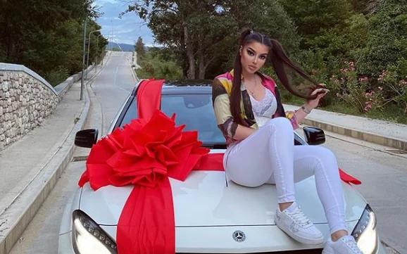 Rachel gets a gift from a luxury car, finds out who bought it for her.