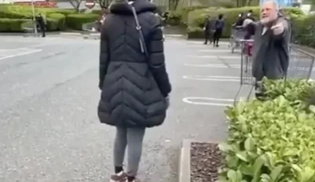 The man threatens to hit his wife for not maintaining social distance