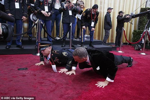 Old Tom Hanks challenges American soldier on a red carpet with a skeet