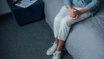 Why is it important not to let anyone sit on your bed when it comes from outside?