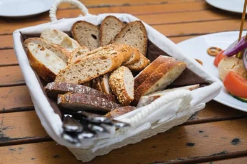 The only reason why you shouldn't eat the bread you are served at the restaurant