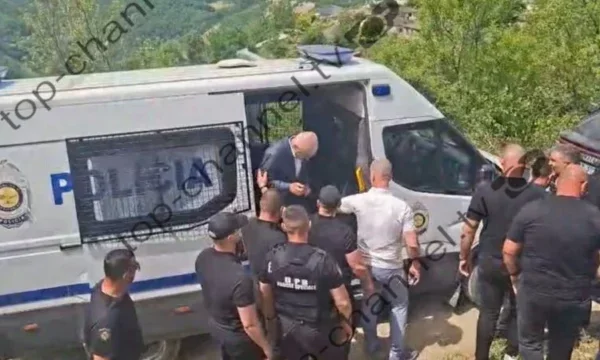 Ilir Meta arrives at the funeral of his father, prison police escort him at every step