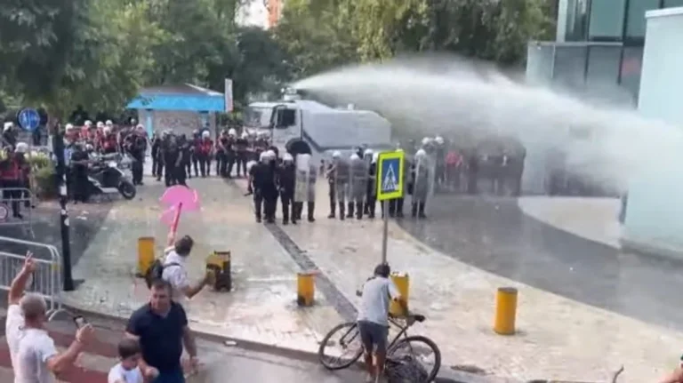 Tensions outside Albania's Parliament, police water protesters